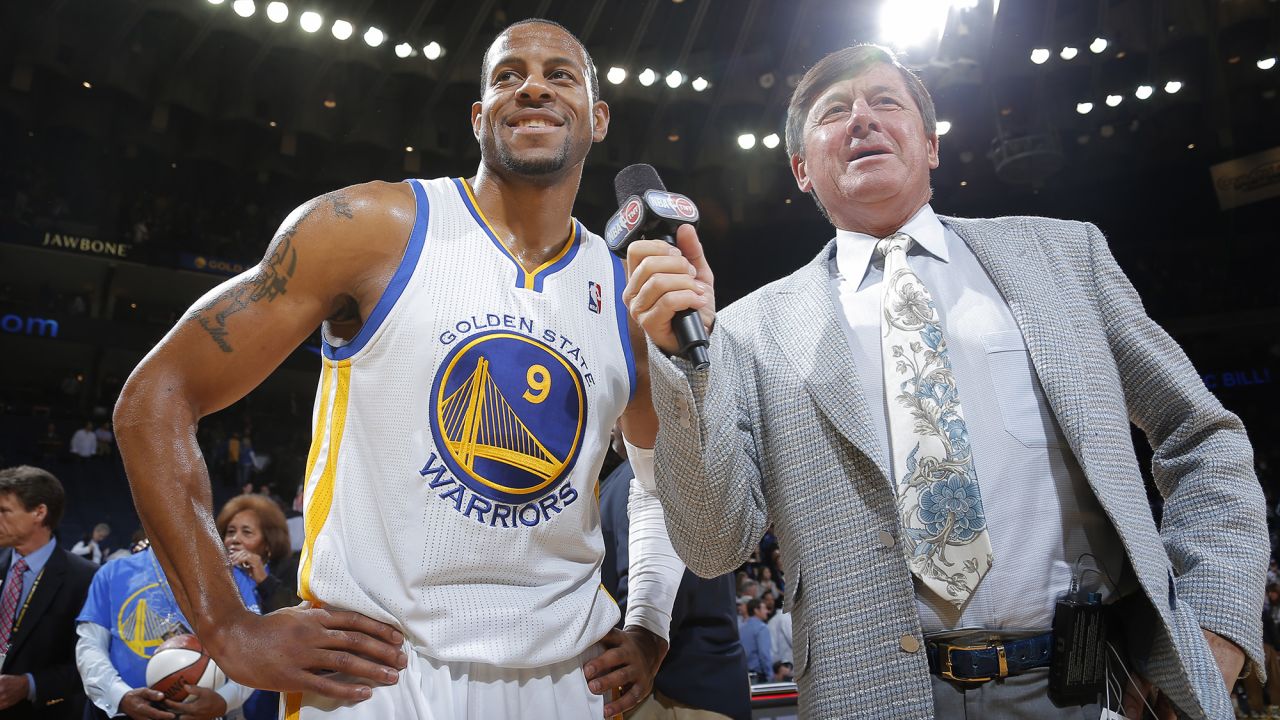 Sager speaks to Andre Iguodala of the Golden State Warriors in 2013. Sager has long had an ebullient personality: While a student at Northwestern University, he served as Willie the Wildcat, the school's mascot.