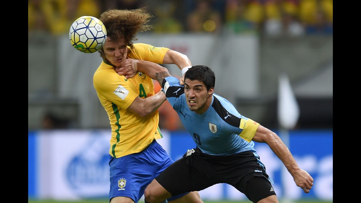 Uruguay's Luis Suarez, right, fends off Brazil's David Luiz during a World Cup qualifier in Recife, Brazil, on Friday, March 25. It was Suarez's <a href="http://www.cnn.com/2016/03/26/football/football-suarez-neymar-brazil-uruguay/index.html" target="_blank">first international match</a> since he bit Italy's Georgio Chiellini at the 2014 World Cup. He scored the last goal in a 2-2 draw.