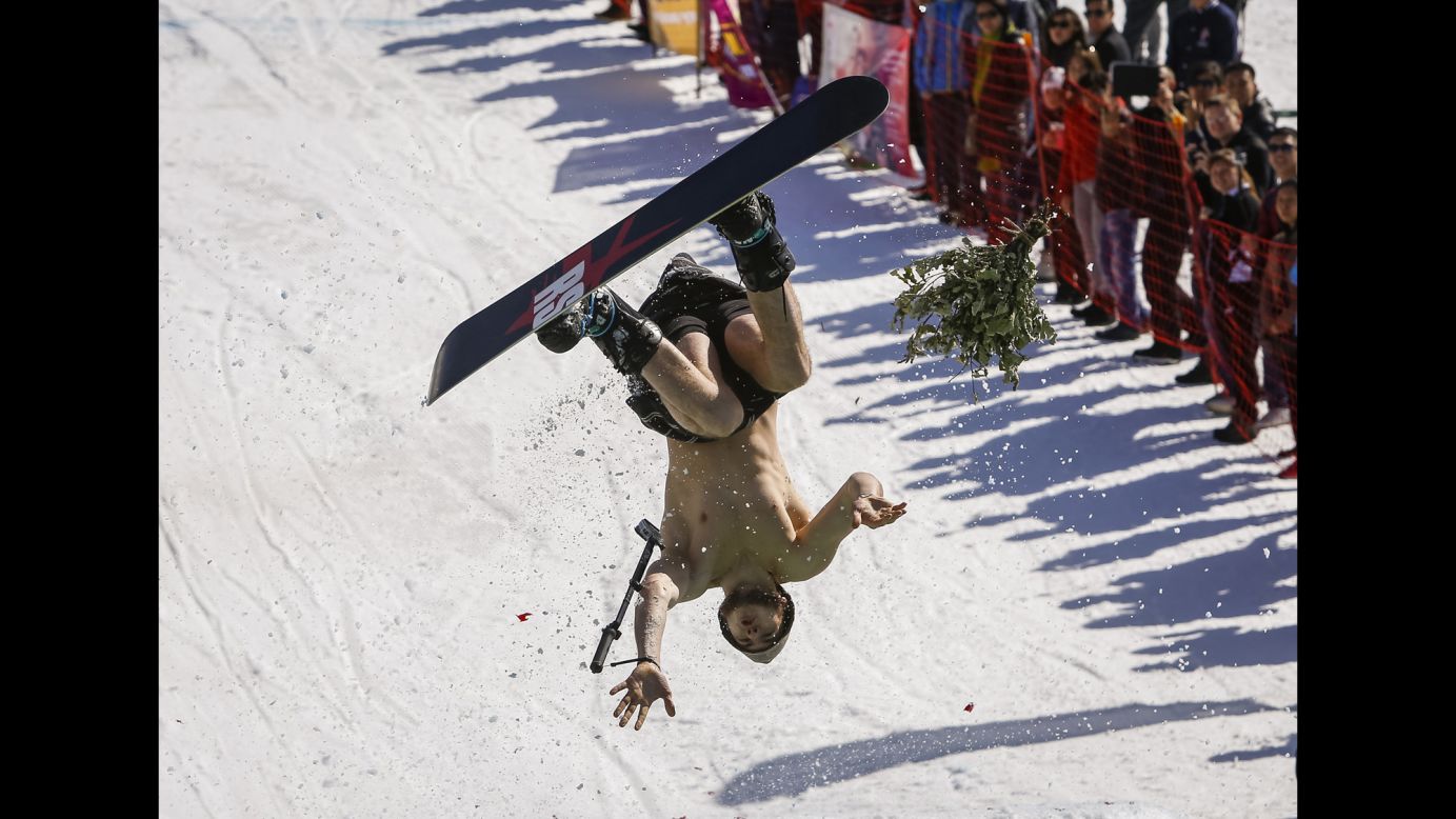 A snowboarder performs during the Red Bull Jump and Freeze competition near Almaty, Kazakhstan, on Tuesday, March 22.