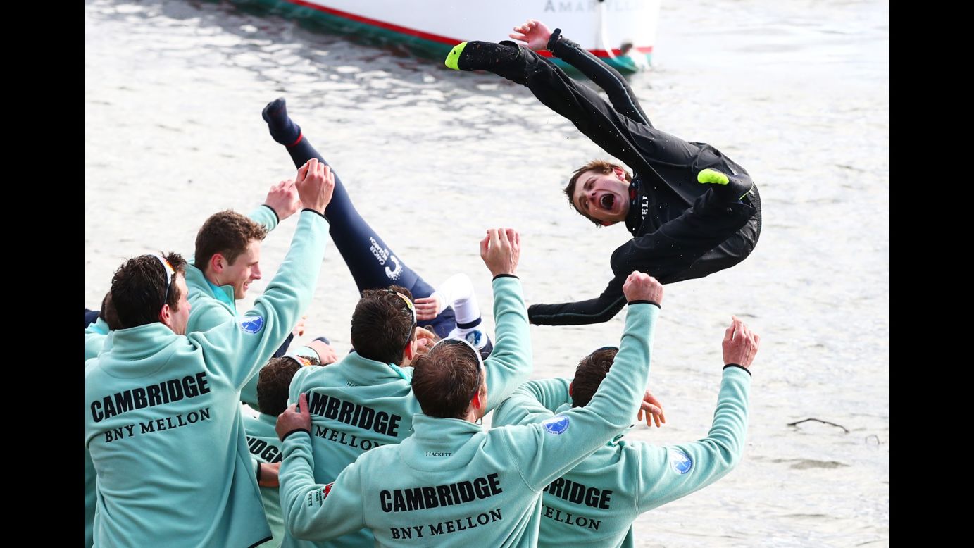 Ian Middleton, the cox of the victorious Cambridge crew, is thrown into the River Thames after beating Oxford in London's historic Boat Race on Sunday, March 27.