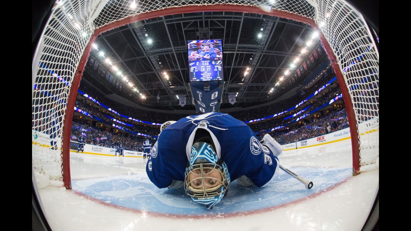 Tampa Bay goalie Ben Bishop stretches before the third period of an NHL game on Tuesday, March 22.