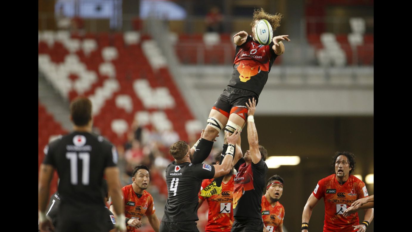 RG Snyman, a rugby player with the Bulls, is lifted by his teammates Saturday, March 26, during a Super Rugby match against the Sunwolves in Singapore. The Bulls are based in Pretoria, South Africa. The Sunwolves hail from Tokyo.