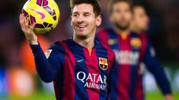 BARCELONA, SPAIN - DECEMBER 07: Lionel Messi of FC Barcelona with the match ball after scoring three goals during the La Liga match between FC Barcelona and RCD Espanyol at Camp Nou on December 7, 2014 in Barcelona, Spain. (Photo by Alex Caparros/Getty Images)