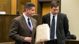 Attorney Daniel Herbert, left, leaves the courtroom with his client, Chicago police officer Jason Van Dyke. after a hearing in the Leighton Criminal Court Building on December 18, 2015 in Chicago, Illinois.
