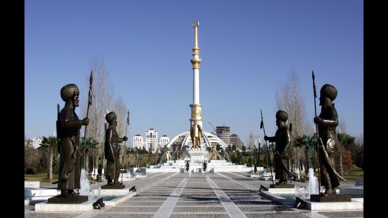 This is Ashgabat's statue of liberty, at its foot a golden Niyazov, kept safe by armed guards.