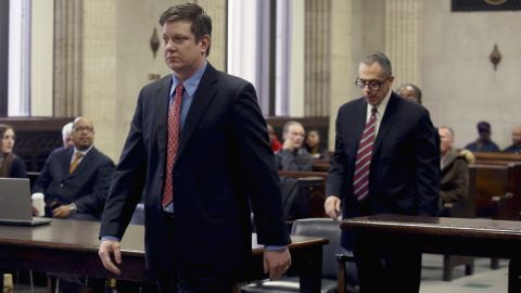 Van Dyke approaches the bench during a March procedural hearing. 