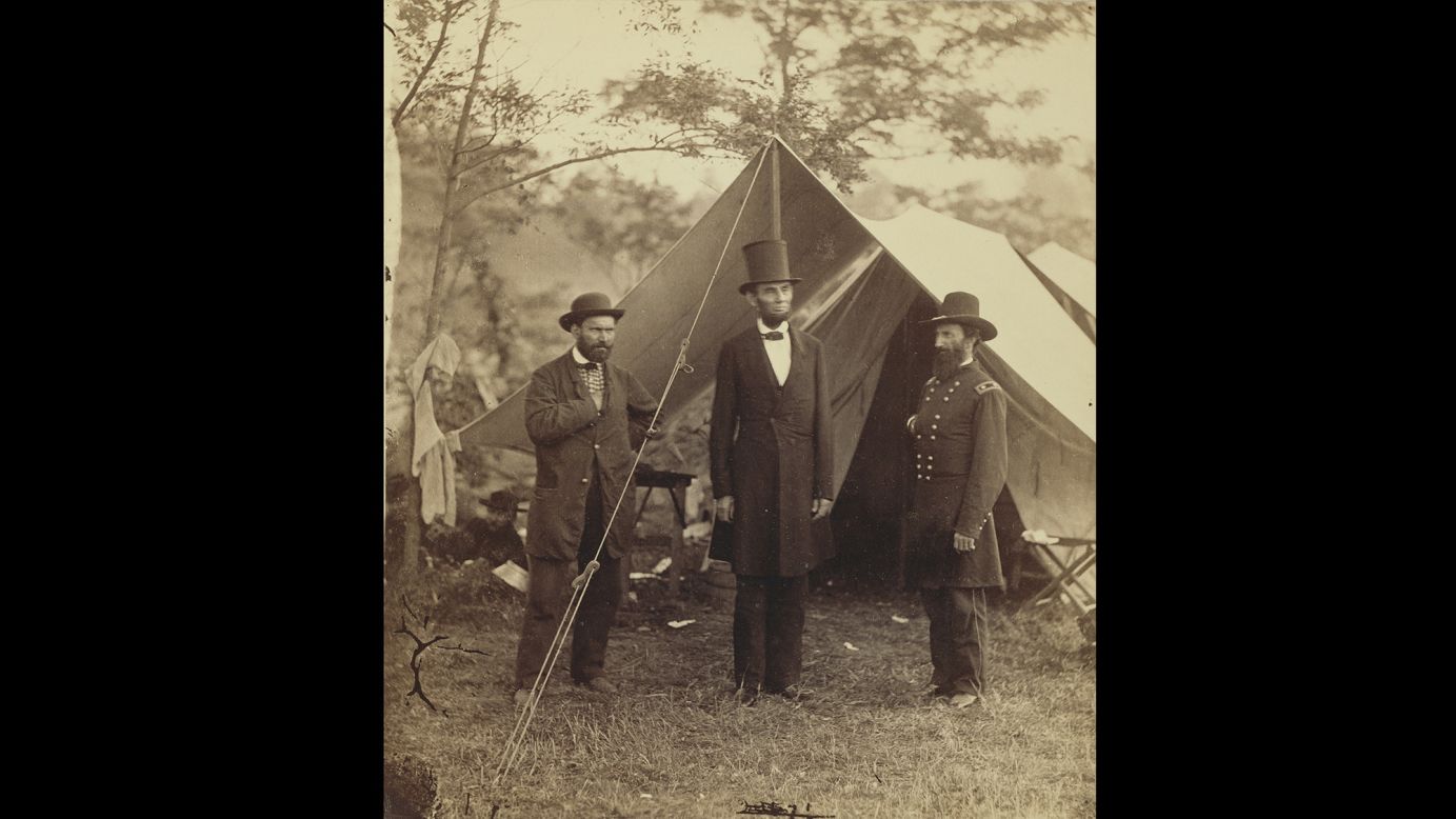 U.S. President <a href="http://www.cnn.com/2015/06/18/us/gallery/tbt-abraham-lincoln-portraits/" target="_blank">Abraham Lincoln,</a> center, was photographed by Alexander Gardner on the Antietam battlefield in Maryland. The Scottish-born Gardner immigrated to the United States at the beginning of the Civil War. He became friends with Allan Pinkerton, left, who was a private investigator and head of the Union Intelligence Service.