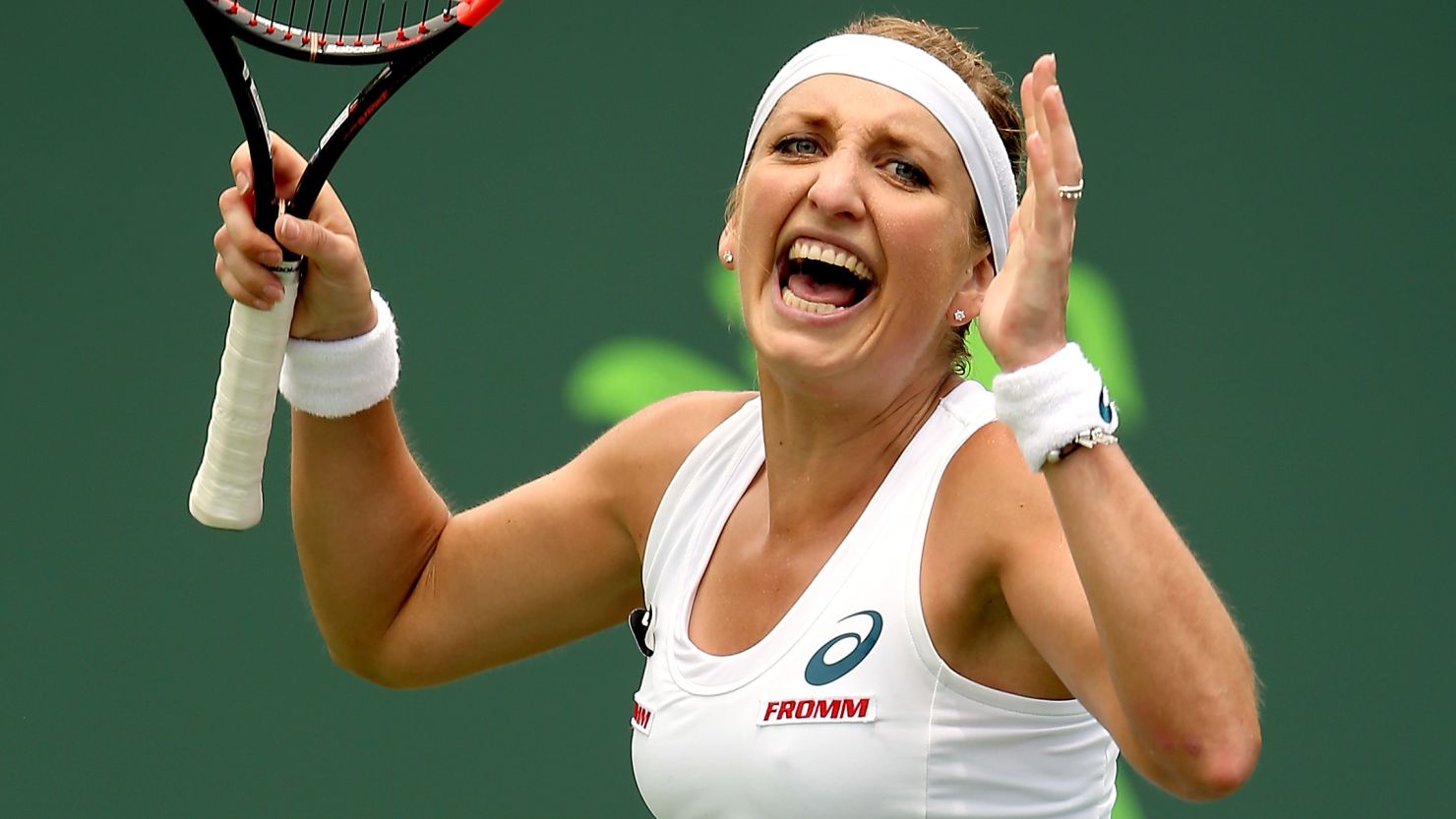 Timea Bacsinszky celebrates her victory over Agnieszka Radwanska at the Miami Open.