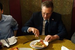 GOP Presidential Candidate John Kasich eats a piece of pizza at Gino's Pizzeria and Restaurant on March 30, 2016 in the Queens borough of New York City.