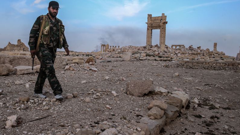 <strong>After:</strong> A Syrian government soldier walks near what's left of the Temple of Baalshamin on Sunday, March 27. Syrian forces retook the city days before, but damage had already been done by ISIS. UNESCO says it plans to evaluate the extent of <a href="index.php?page=&url=http%3A%2F%2Fwww.cnn.com%2F2016%2F03%2F28%2Fmiddleeast%2Fisis-palmyra-treasures-destroyed%2Findex.html" target="_blank">Palmyra's damage</a> soon. Many of the structures -- which date from the first and second centuries and marry Greco-Roman techniques with local traditions and Persian influences -- remain in place, bolstering hopes that ISIS didn't completely raze the world heritage site.