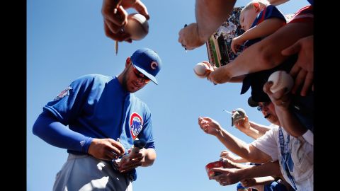 Chicago Cubs slugger Kris Bryant, the National League's Rookie of the Year in 2015, signs autographs before a spring-training game in Peoria, Arizona, on March 10.