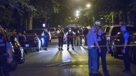 Chicago police at a shooting scene where five people were reported to have been shot, including an 11-month-old , in September  2015.