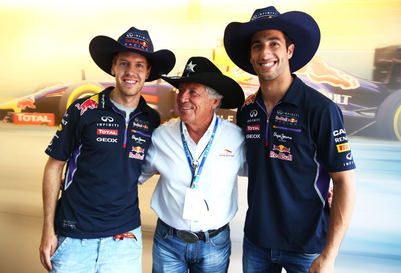 Andretti posing with Sebastian Vettel of Daniel Ricciardo at Monza in 2014 when the pair were teammates at Red Bull Racing. Andretti says F1 is in good hands despite controversies over recent rule changes to qualifying.