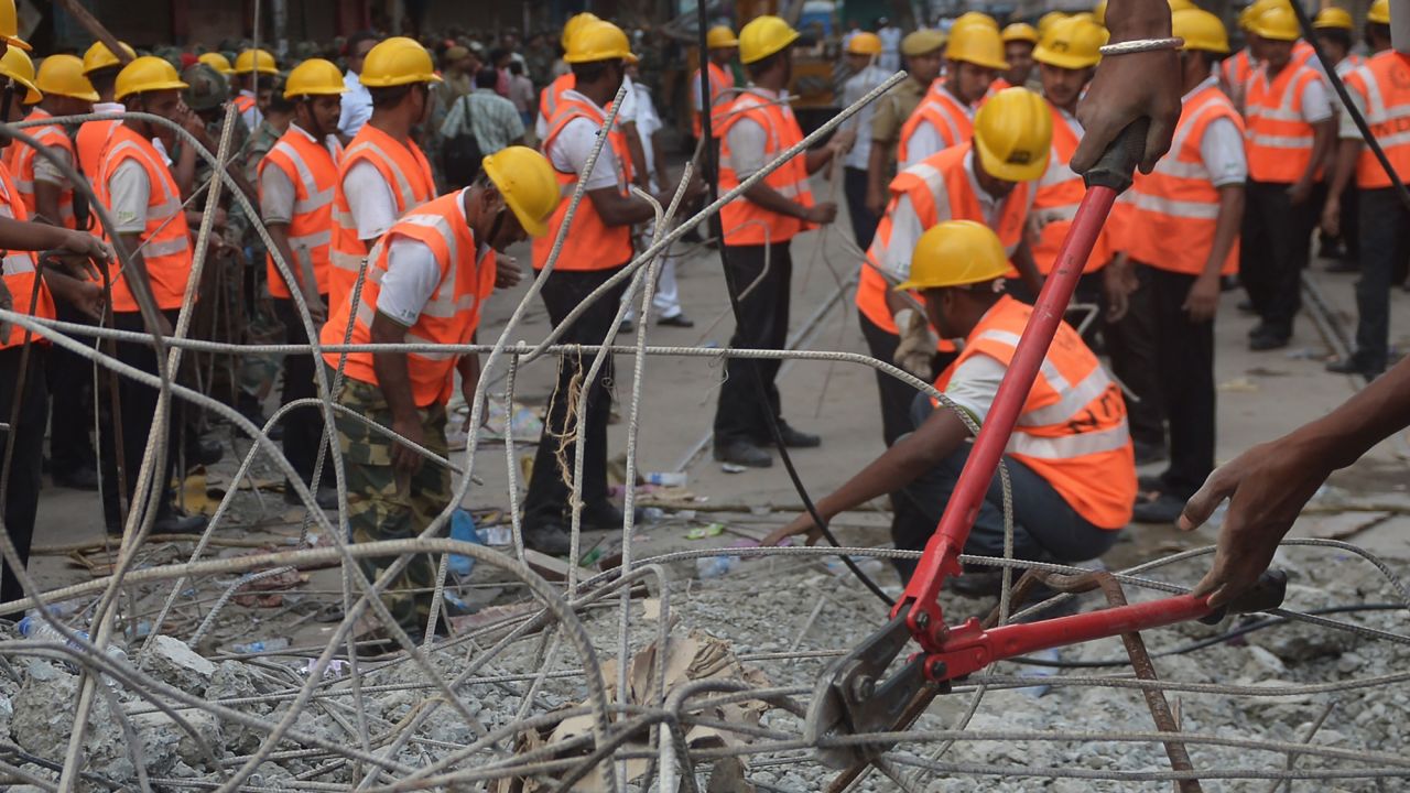 Rescue workers cut rebar and clear debris  while looking for people trapped under the wreckage on April 1.