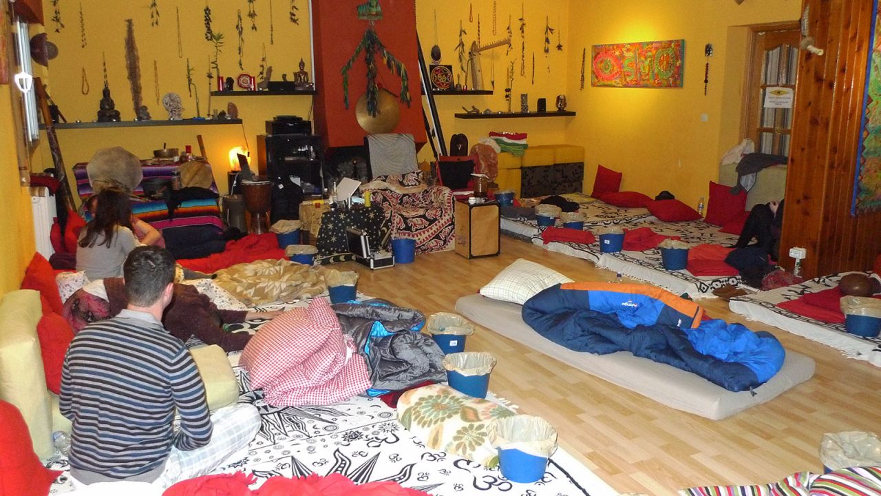 A recent session in a house in a small village in Spain gathered people looking for a life-changing experience. Mattresses are laid on the floor for participants.
