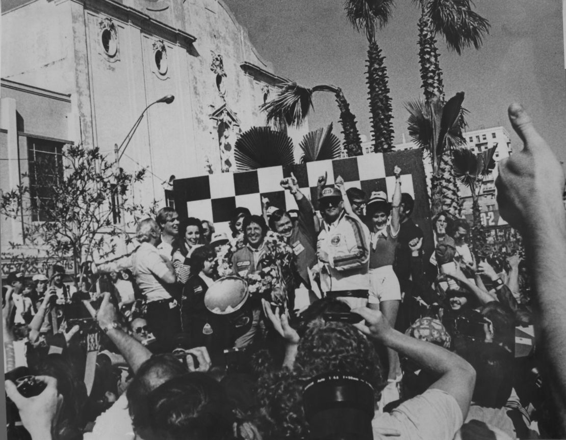 Happy days! Mario Andretti celebrates his win at the 1977 United States GP West at Long Beach. 