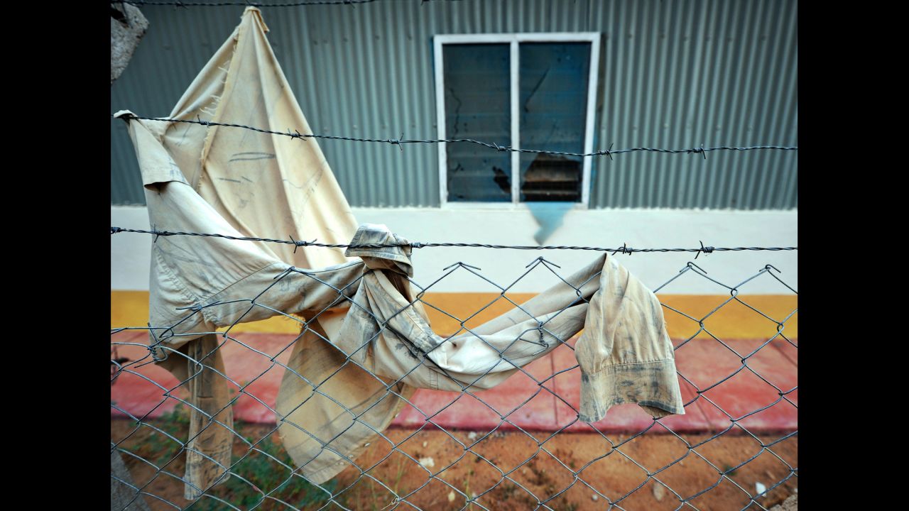 A garment remained on the barbed wire fence near one of the dormitories targeted in the deadly siege.  