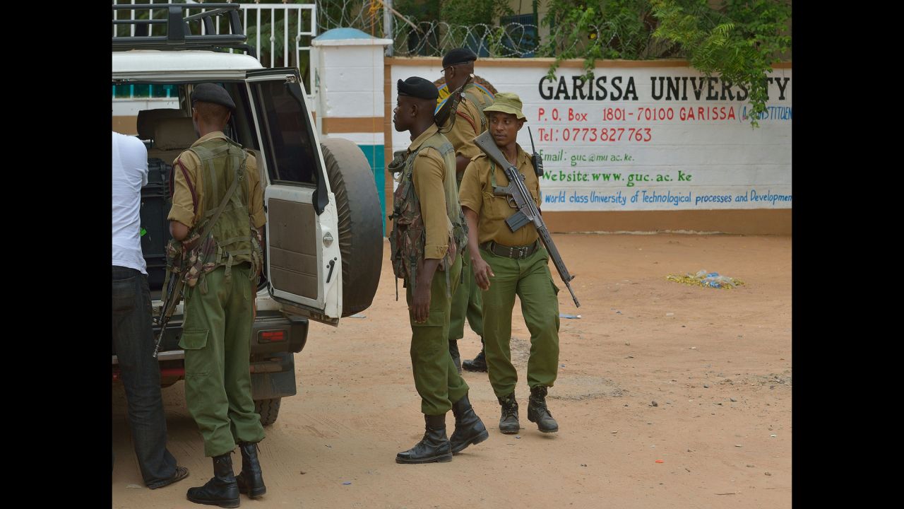Security officers conduct a search on a vehicle arriving at the school.  A police station has been set up at the school and security has been increased from four officers to 30.