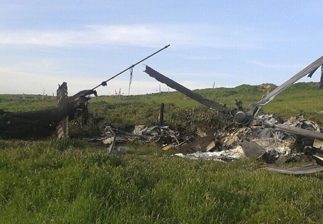 A downed Azerbaijani helicopter lies in a field in the Nagorno-Karabakh region Saturday. 