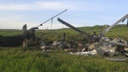 Remains of a downed Azerbaijani forces helicopter lies in a field in the separatist Nagorno-Karabakh region, on Saturday, April 2, 2016.  In a statement, Azerbaijan's Defense Ministry said 12 of its soldiers "became shards" (Muslim martyrs) and said one of its helicopters was shot down.  At least 30 soldiers and a boy were reported killed as heavy fighting erupted Saturday between Armenian and Azerbaijani forces over the separatist region of Nagorno-Karabakh. (AP Photo)