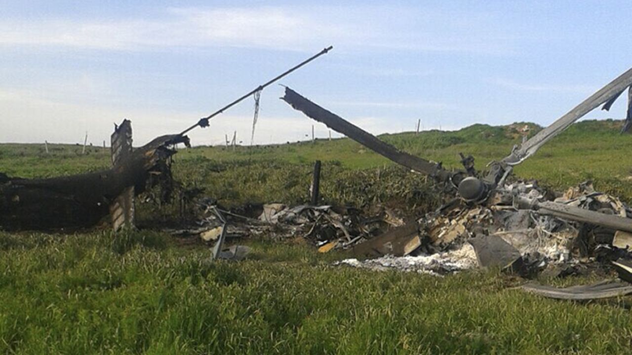 A downed Azerbaijani helicopter lies in a field in the Nagorno-Karabakh region Saturday. 