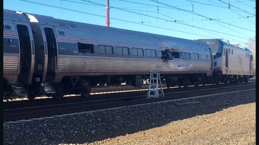 This photo shows an Amtrak train following an accident Sunday, April 3, 2016, in Chester, Pa. Amtrak said the train was heading from New York to Savannah, Ga., when it struck a backhoe outside of Philadelphia. (Glenn R. Hills Jr via AP) MANDATORY CREDIT