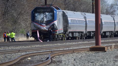 Emergency crews investigate the site of Sunday's Amtrak train crash near Philadelphia.