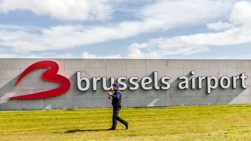 A policeman patrols at Brussels Airport, in Zaventem, Belgium, Sunday, April 3, 2016. Under extra security, three Brussels Airlines flights, the first for Faro in Portugal, are scheduled to leave Sunday from an airport that used to handle about 600 flights a day. (AP Photo/Geert Vanden Wijngaert)