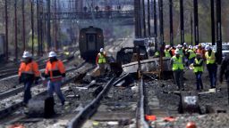 CHESTER, PA - APRIL 3:  Emergency personnel investigate the crash site of Amtrak Palmetto train 89 on April 3, 2016 in Chester, Pennsylvania.  Two people are confirmed dead after the lead engine of the train struck a backhoe that was on the track south of Philadelphia, according to published reports. Approximately 341 passengers and seven crew members were onboard the train, which was traveling from New York to Savannah, according to Amtrak.  (Photo by Mark Makela/Getty Images)
