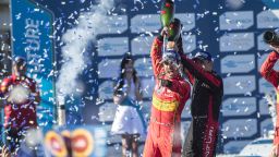 Lucas Di Grassi (center) celebrates winning the 2016 Long Beach ePrix.