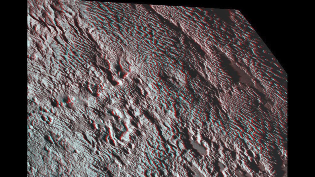 New Horizons photographed what scientists are calling "bladed" terrain near the heart-shaped region of the dwarf planet. This 3-D image was created using two images taken about 14 minutes apart on July 14. The first image was snapped about 16,000 miles (25,000 kilometers) from Pluto and the second was taken when the spacecraft was 10,000 miles (about 17,000 kilometers) away. Break out your 3-D glasses for the best view.