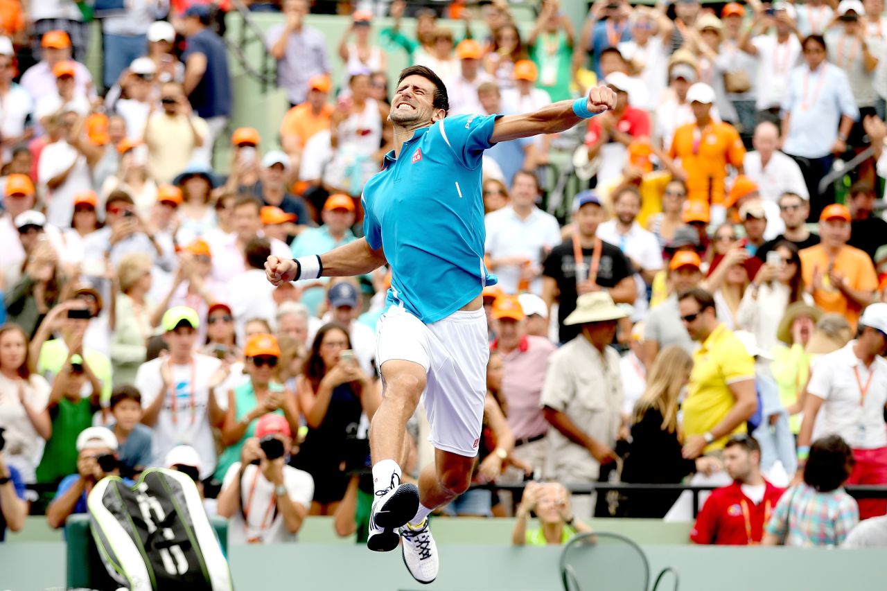 Novak Djokovic celebrates victory against Kei Nishikori of Japan in the final of the 2016 Miami Open.
