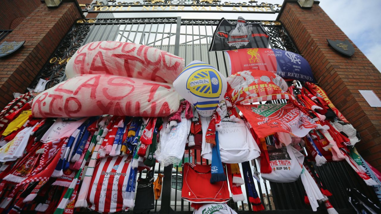LIVERPOOL, ENGLAND - SEPTEMBER 17: Tributes to the victims of the Hillsborough Disaster adorn the Hillsborough memorial and the Bill Shankly gates at Anfield stadium on September 17, 2012 in Liverpool, England. In the wake of the Hillsborough files disclosure, families of the victims and support groups are calling for the Attoney General to open new inquests in the city and to pursue any possible criminal prosecutions. (Photo by Christopher Furlong/Getty Images)