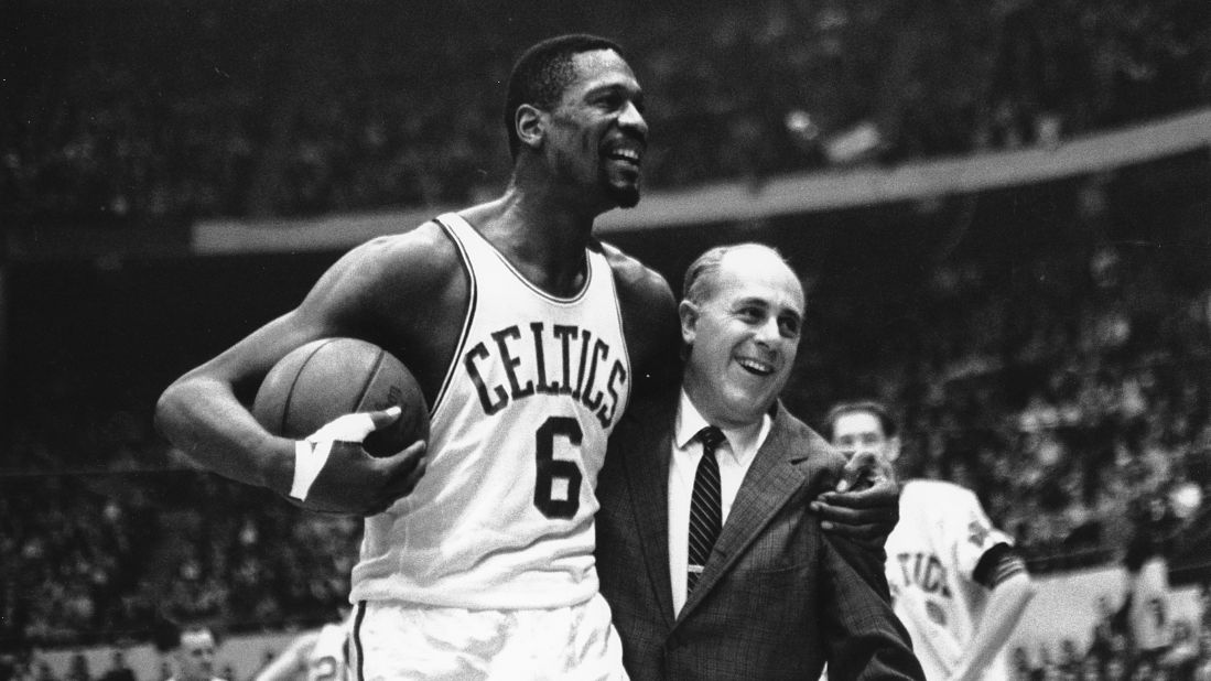 <strong>Most NBA titles (player):</strong> Bill Russell, seen here with legendary coach Red Auerbach, won 11 titles in his 13 NBA seasons. The big man won all of them with Boston, starting in 1957 and ending in 1969.