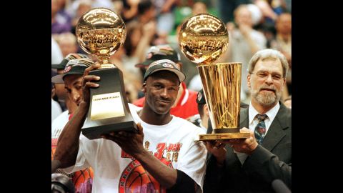 <strong>Most Finals MVP awards: </strong>Michael Jordan was named the Most Valuable Player for all six Finals he played in. The Bulls guard holds his 1998 award here next to head coach Phil Jackson.