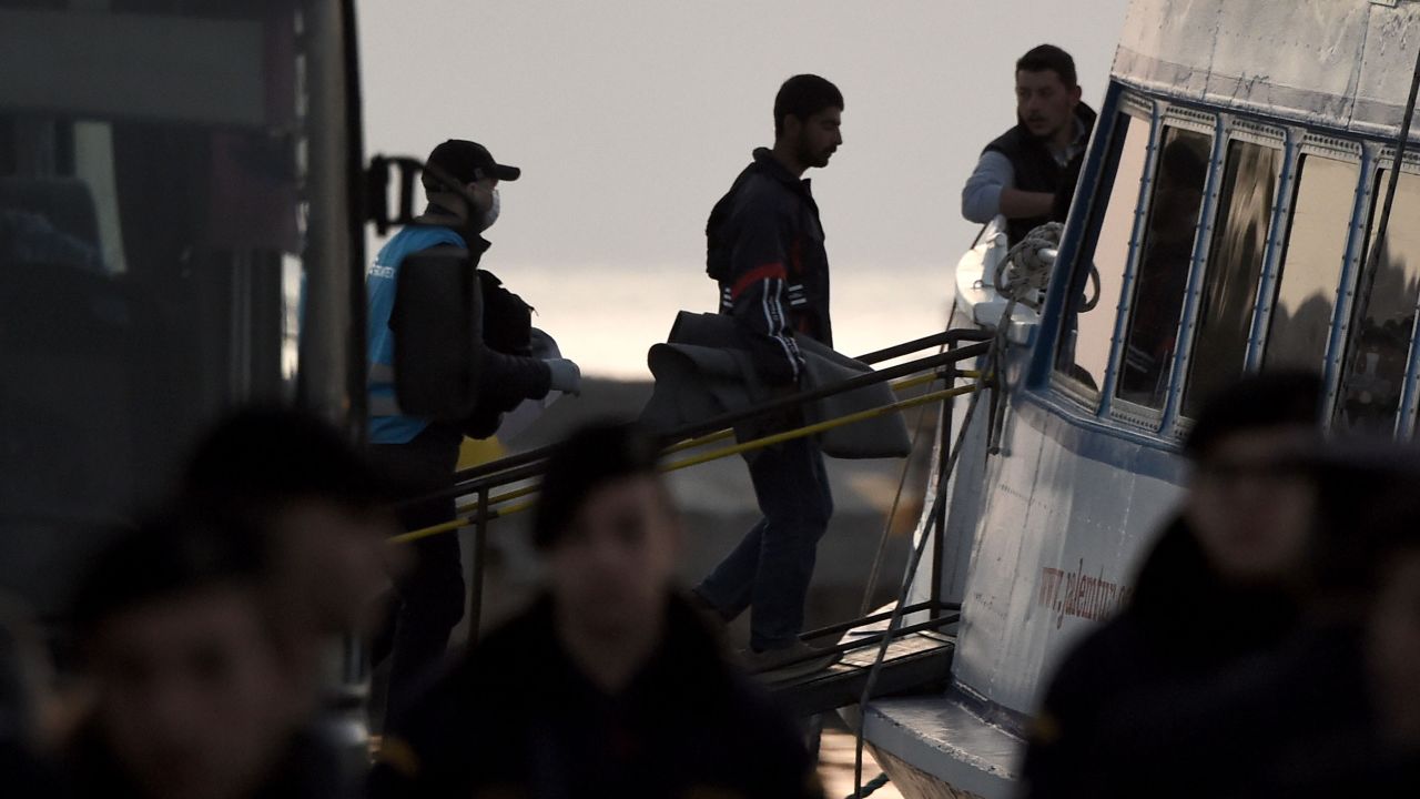 Migrants are deported to Turkey from the port of Mytilene on April 4.