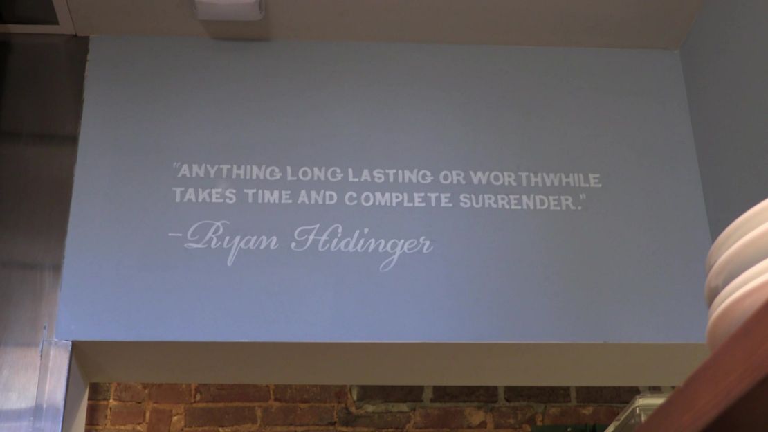 A quote from Ryan Hidinger on the wall at the Staplehouse restaurant.