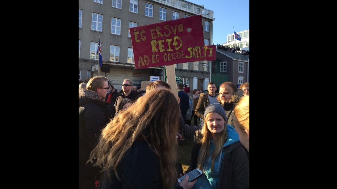 "I'm so angry I made a sign," one demonstrator's sign said.