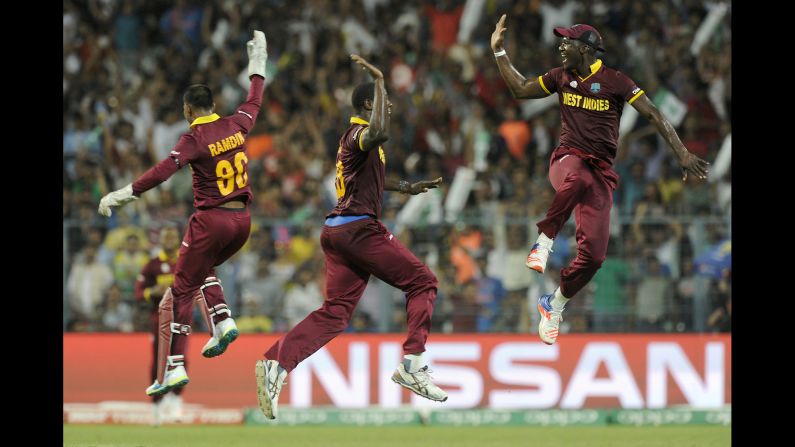 Cricket players from the West Indies celebrate during the final of the World Twenty20, which they won Sunday, April 3, in Kolkata, India. The "Windies" defeated England for their second Twenty20 title.