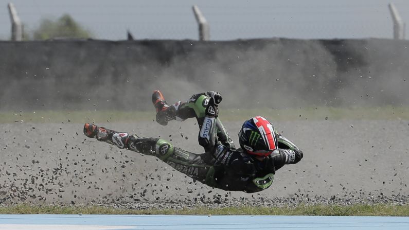 Bradley Smith falls off his motorcycle during a MotoGP qualifying session on Saturday, April 2. He raced the next day and finished eighth in the Argentina Grand Prix. 