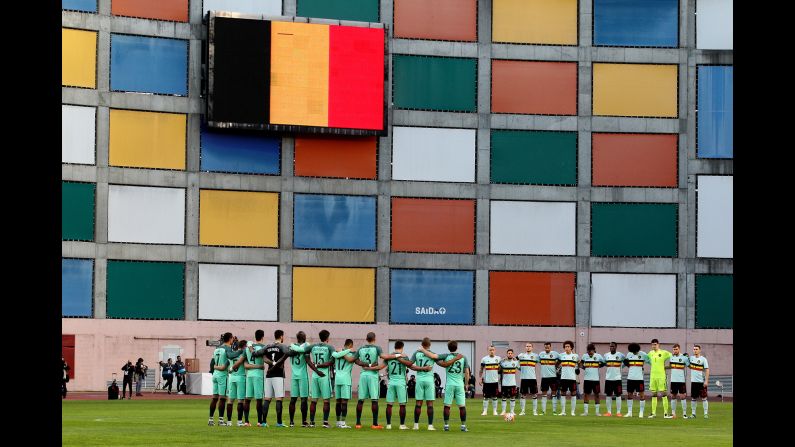 The Belgian national soccer team, right, and the Portuguese national team observe a minute of silence Tuesday, March 29, for the victims of the Brussels terror attacks. The international friendly match, initially scheduled for the Belgian capital, <a href="index.php?page=&url=http%3A%2F%2Fwww.cnn.com%2F2016%2F03%2F29%2Ffootball%2Fgallery%2Ffootball-brussels-paris-portugal%2Findex.html" target="_blank">was moved to Leiria, Portugal.</a>