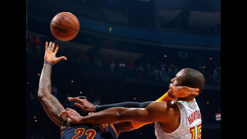 Atlanta's Al Horford fouls Cleveland's LeBron James during an NBA game in Atlanta on Friday, April 1.