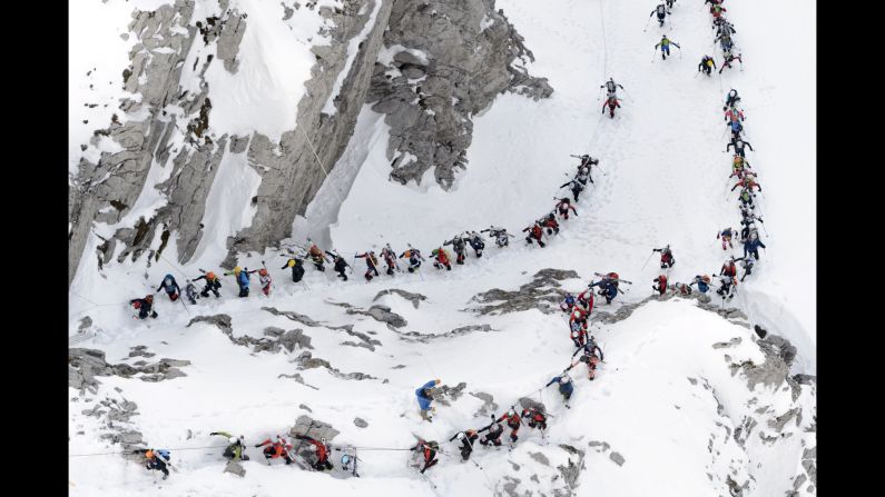 Skiers climb Sunday, April 3, during the Trophees du Muveran, a mountaineering race in the Swiss Alps.