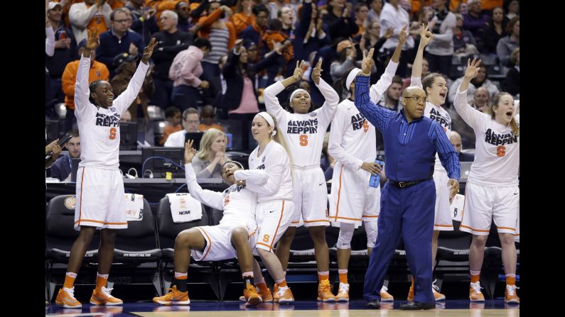 Syracuse's bench reacts to a 3-pointer during the team's Final Four win on Sunday, April 3. The Orange defeated Washington 80-59 to advance to the championship game.