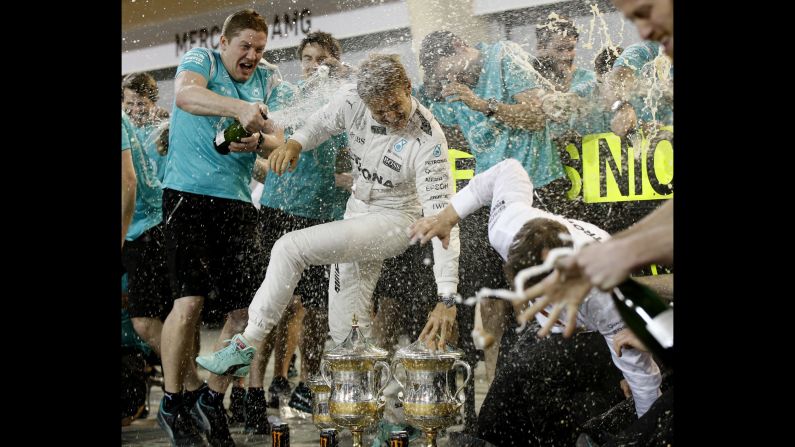 Formula One driver Nico Rosberg is sprayed by members of his team after winning the Bahrain Grand Prix on Sunday, April 3. Rosberg has won both of this season's F1 races.