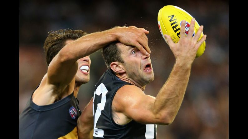 Travis Cloke of the Collingwood Magpies has his vision obscured by Alex Rance of the Richmond Tigers during an Australian Football League match in Melbourne on Friday, April 1.