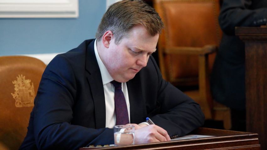 Iceland's Prime Minister Sigmundur David Gunnlaugsson, writes during a parliamentary session in Reykjavik on Monday April 4, 2016. Iceland's prime minister insisted Monday he would not resign after documents leaked in a media investigation allegedly link him to an offshore company that would represent a serious conflict of interest, according to information leaked from a Panamanian law firm at the center of an international tax evasion scheme. (AP Photo/Brynjar Gunnarsson)