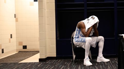 North Carolina's Theo Pinson sits in the locker room after the loss.