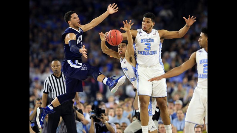 Villanova's Josh Hart scrambles for a loose ball along with Paige and Meeks.