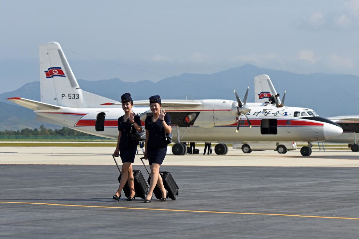 Air Koryo flight attendants walk near an Antonov An-24 at North Korea's Wonsan Airport in September 2015. Juche Travel's upcoming aviation tour of Belarus and North Korea offers opportunities to fly on a variety of rare Soviet-era aircraft. 